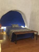 Postel nebo postele na pokoji v ubytování Casas Cueva y Cortijo La Tala en Guadix