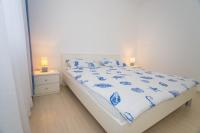 Łóżko lub łóżka w pokoju w obiekcie Apartment Aldo II