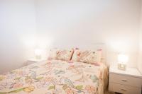 Postel nebo postele na pokoji v ubytování Los Cristianos 3