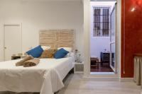 Posteľ alebo postele v izbe v ubytovaní Living4Malaga Skyline Apartments