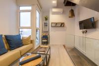 Televízia a/alebo spoločenská miestnosť v ubytovaní Living4Malaga Skyline Apartments