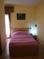 A bed or beds in a room at Affittacamere La Martina