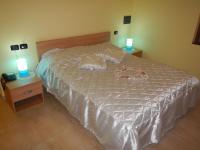 A bed or beds in a room at Affittacamere La Martina
