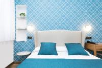 Postel nebo postele na pokoji v ubytování Hostal Oriente