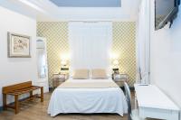 Postel nebo postele na pokoji v ubytování Hostal Oriente