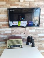 TV a/nebo společenská místnost v ubytování Apartamentos Santabarbara