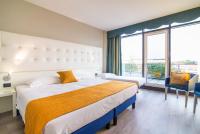 Łóżko lub łóżka w pokoju w obiekcie Hotel Viest