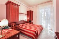 A bed or beds in a room at Hotel Villa Pina