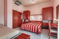 A bed or beds in a room at Hotel Villa Pina