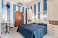 A bed or beds in a room at Hotel Villa Pina