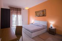 A bed or beds in a room at Sandalia B&B