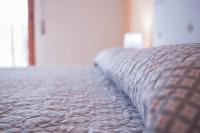 A bed or beds in a room at Sandalia B&B