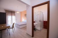 A bed or beds in a room at Sandalia B&B