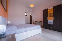 A bed or beds in a room at Sandalia B&B