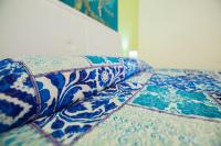 A bed or beds in a room at Sandalia B&B