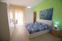 A bed or beds in a room at Sandalia B&B