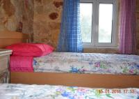 Postel nebo postele na pokoji v ubytování Rumpis Traditional House