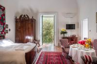 A bed or beds in a room at Palazzo Bernardini Suites