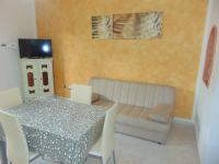 A television and/or entertainment centre at Appartamenti Budoni