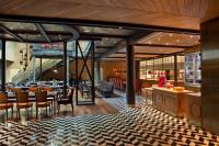 a restaurant with a bar and some tables and chairs at Four Seasons Hotel Buenos Aires in Buenos Aires