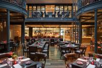 a restaurant with tables and chairs in a building at Four Seasons Hotel Buenos Aires in Buenos Aires