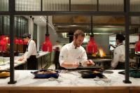 a group of chefs in a kitchen preparing food at Four Seasons Hotel Buenos Aires in Buenos Aires