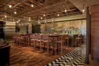 a bar with wooden stools and a bar counter at Four Seasons Hotel Buenos Aires in Buenos Aires