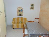 A bed or beds in a room at Appartamenti Budoni