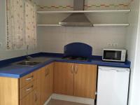 A kitchen or kitchenette at Viviendas Los Olivos - Formentera Break