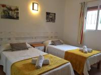 A bed or beds in a room at Viviendas Los Olivos - Formentera Break