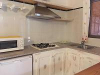 A kitchen or kitchenette at Viviendas Los Olivos - Formentera Break