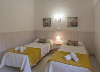 A bed or beds in a room at Viviendas Los Olivos - Formentera Break
