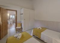 A bed or beds in a room at Viviendas Los Olivos - Formentera Break