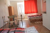 A bed or beds in a room at Penzion Atlas