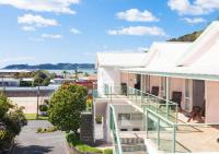 a view from the balcony of a house with a staircase at ASURE Admirals View Motel in Paihia