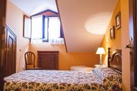 A bed or beds in a room at Posada Marina