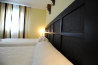 Posteľ alebo postele v izbe v ubytovaní Hotel Montearoma