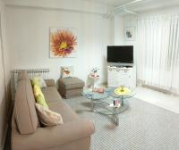 Televízia a/alebo spoločenská miestnosť v ubytovaní Studio Apartment Unity