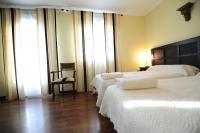 Posteľ alebo postele v izbe v ubytovaní Hotel Montearoma