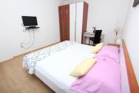 Postel nebo postele na pokoji v ubytování Rooms and Apartment Luana
