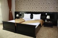 Ένα ή περισσότερα κρεβάτια σε δωμάτιο στο Hotel Imperium