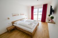 Łóżko lub łóżka w pokoju w obiekcie Finest Kitzblick Golf Suites by All in One Apartments