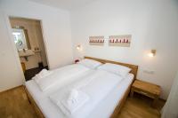 Łóżko lub łóżka w pokoju w obiekcie Finest Kitzblick Golf Suites by All in One Apartments
