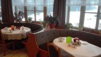 two tables in a restaurant with two tables sidx sidx sidx at Gasthof Panorama in Obsteig