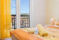 Posteľ alebo postele v izbe v ubytovaní Apartments Ivanović