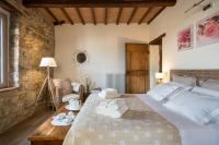 A bed or beds in a room at La Casa di Alice