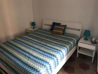 A bed or beds in a room at Appartamenti La Quiete