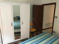 A bed or beds in a room at Appartamenti La Quiete
