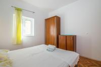 Postel nebo postele na pokoji v ubytování Apartments Antonija