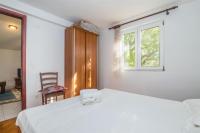 Postel nebo postele na pokoji v ubytování Apartments Antonija